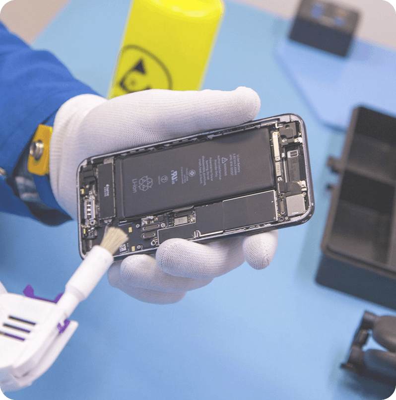 Technician repairing phone
